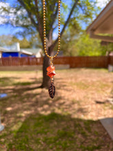 Load image into Gallery viewer, Crystal Swirl & Feather Guardian – Tangerine Aura Quartz Necklace | Wire Wrapped Pendant for Joy & Creative Energy