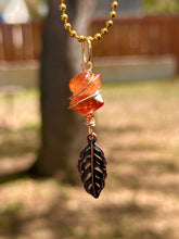 Load image into Gallery viewer, Crystal Swirl & Feather Guardian – Tangerine Aura Quartz Necklace | Wire Wrapped Pendant for Joy & Creative Energy